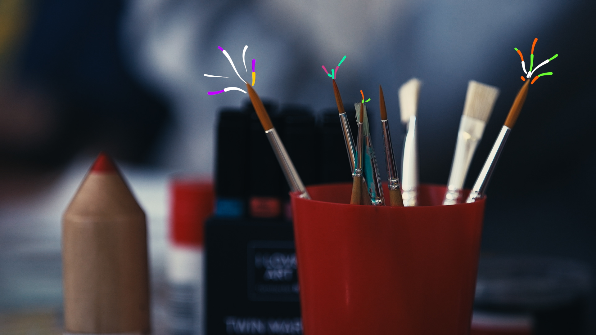 paint brushes in cup